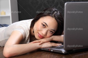Beautiful asian girl at on laptop computer